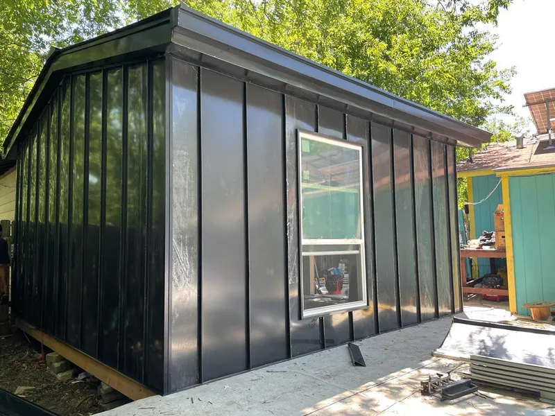 Black standing seam metal wall panels for Roof Inspection in Center Point