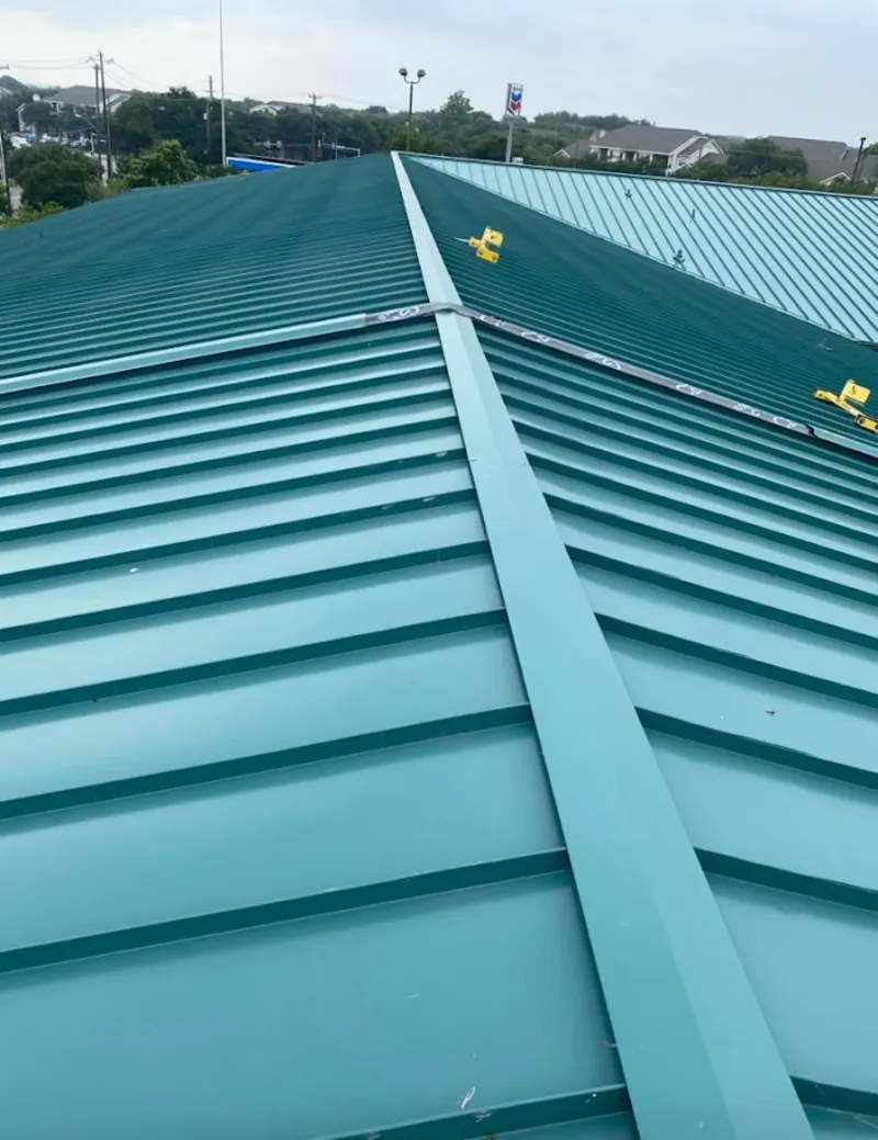 Green commercial metal roof ridge and valley for Metal Roof Repair in Center Point